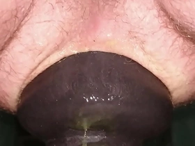 Huge 11cm wide butt plug sliding in my ass on toilet seat up close.